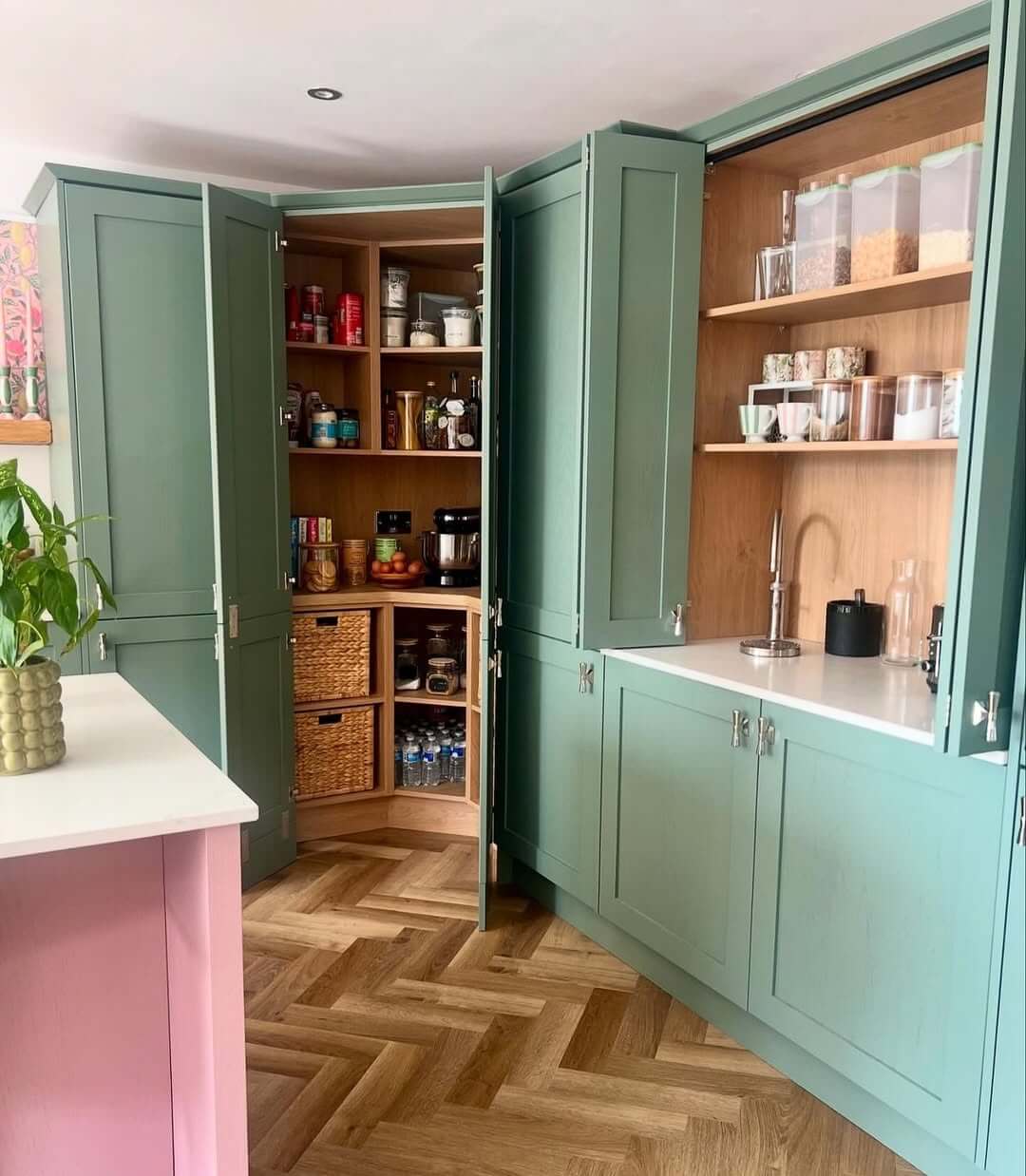 Open Sage Green Cabinetry to Reveal Curved Shelving