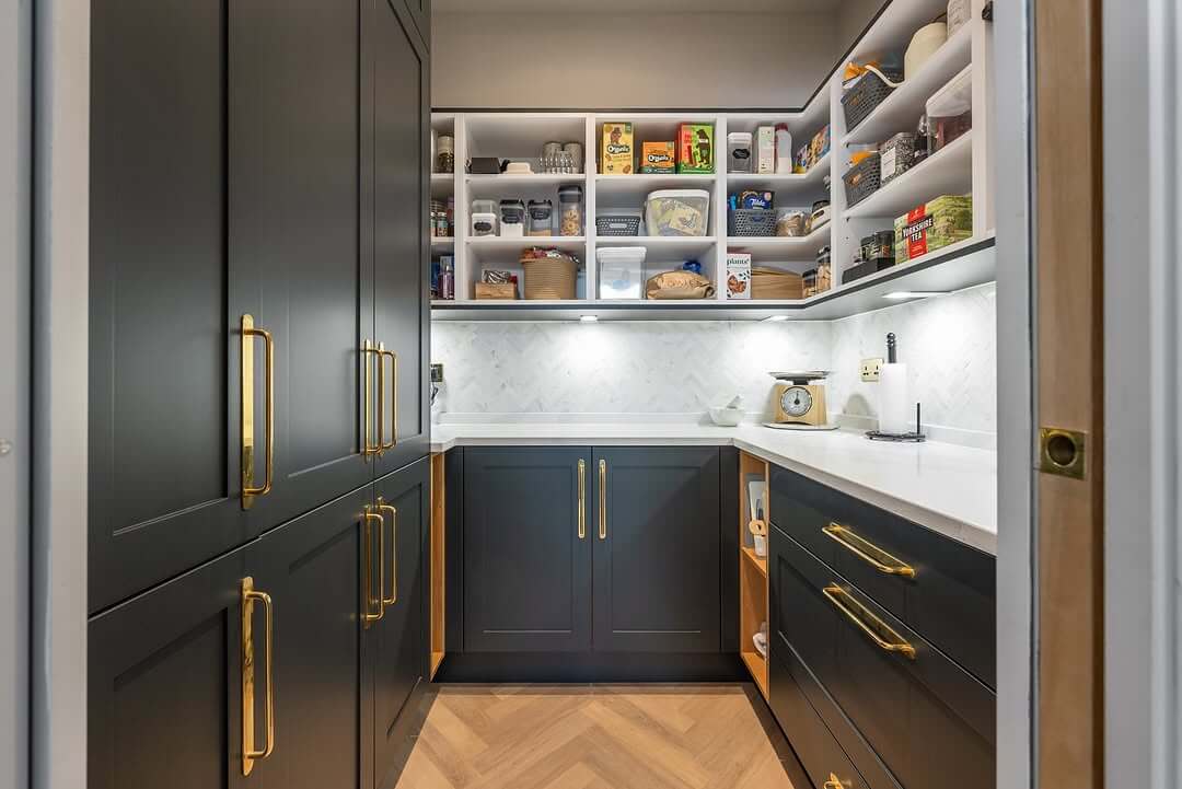Accent Dark Cabinetry with Warm Gold Hardware