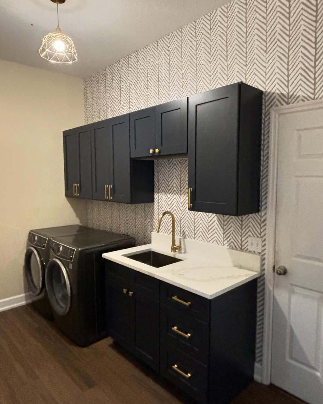 Herringbone Wallpaper Adds Subtle Pattern to Dark Cabinets