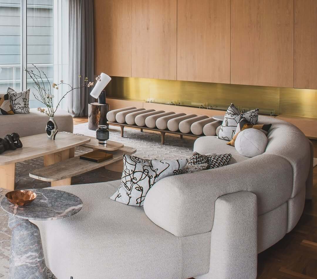 Curved Bouclé Sofa Creates a Cozy, Organic Living Area
