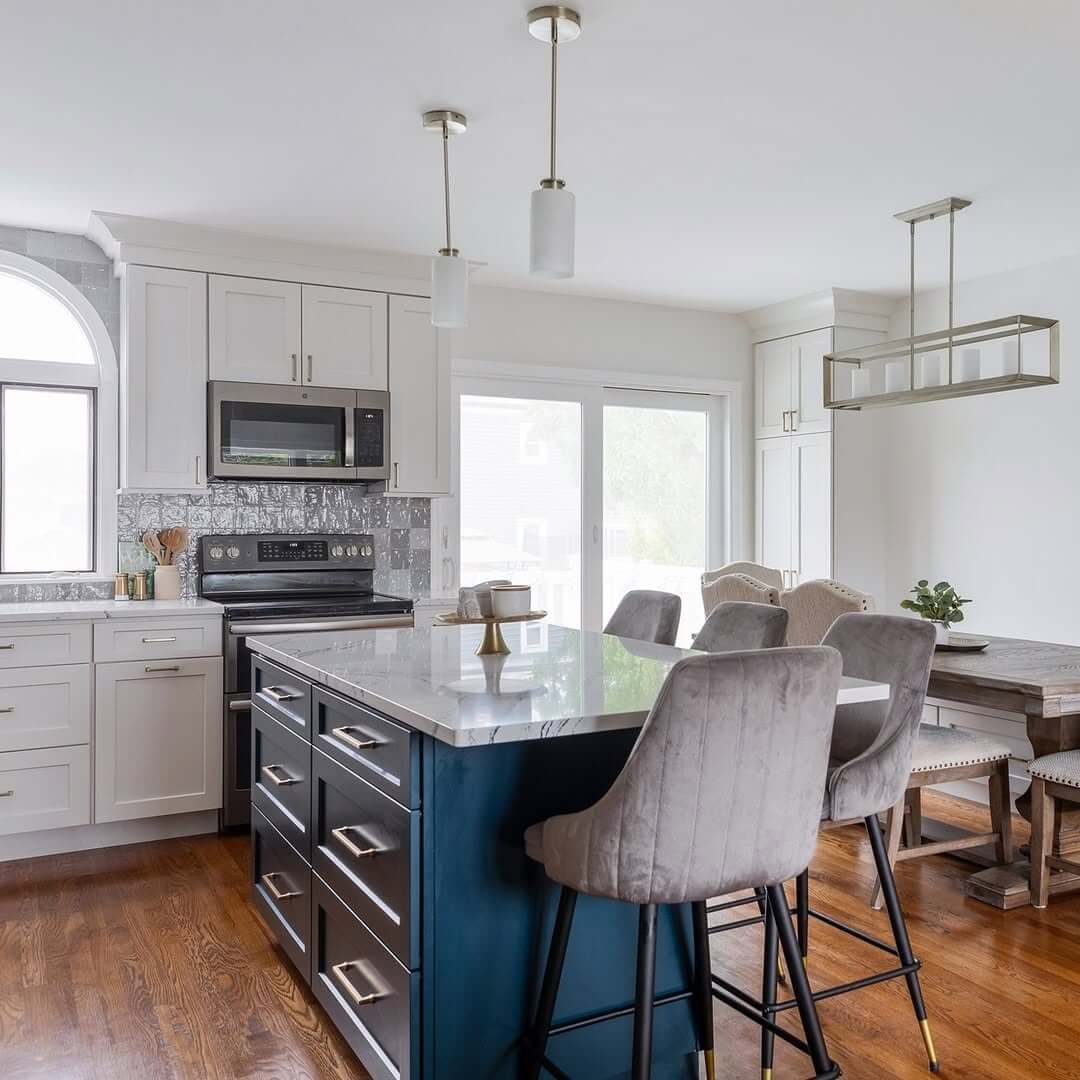 Deep Blue Island With Marble Top Creates A Kitchen Focal Point