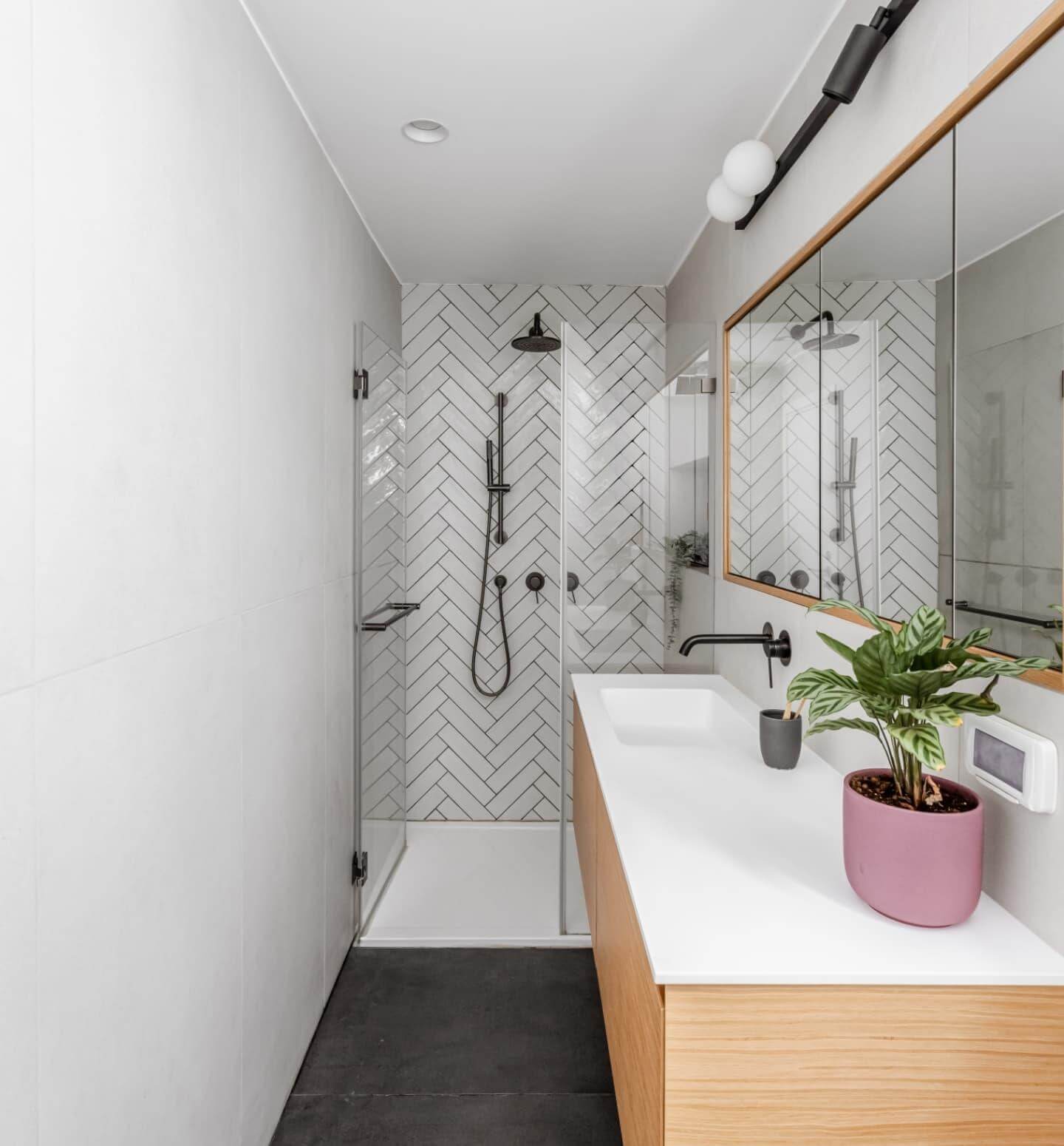 Herringbone Tile Creates Dynamic Shower Wall Texture