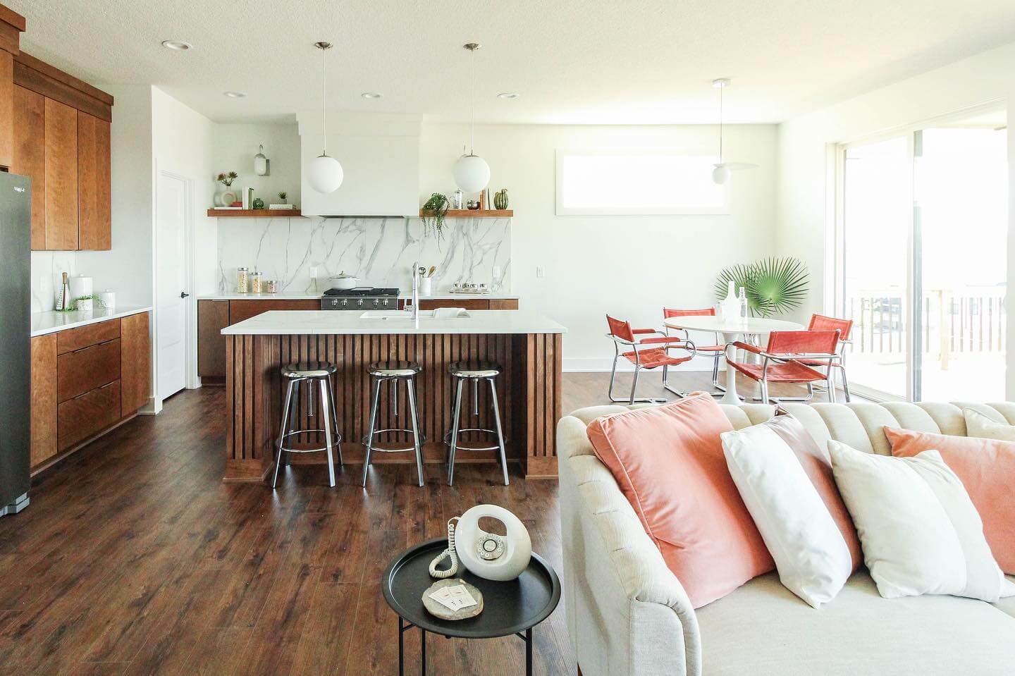 Vertical wood slats add warmth to the kitchen island