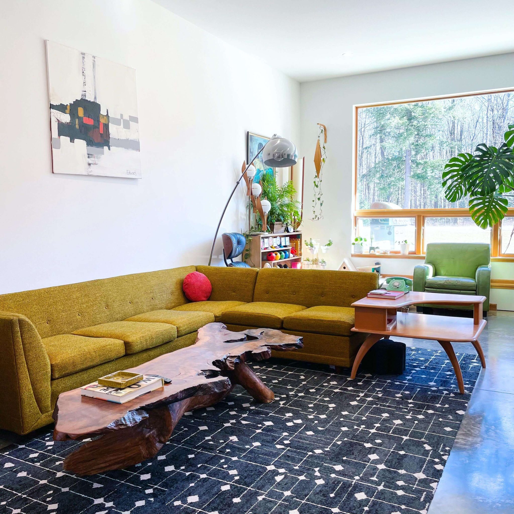 Pair a sculptural live-edge table with a graphic rug