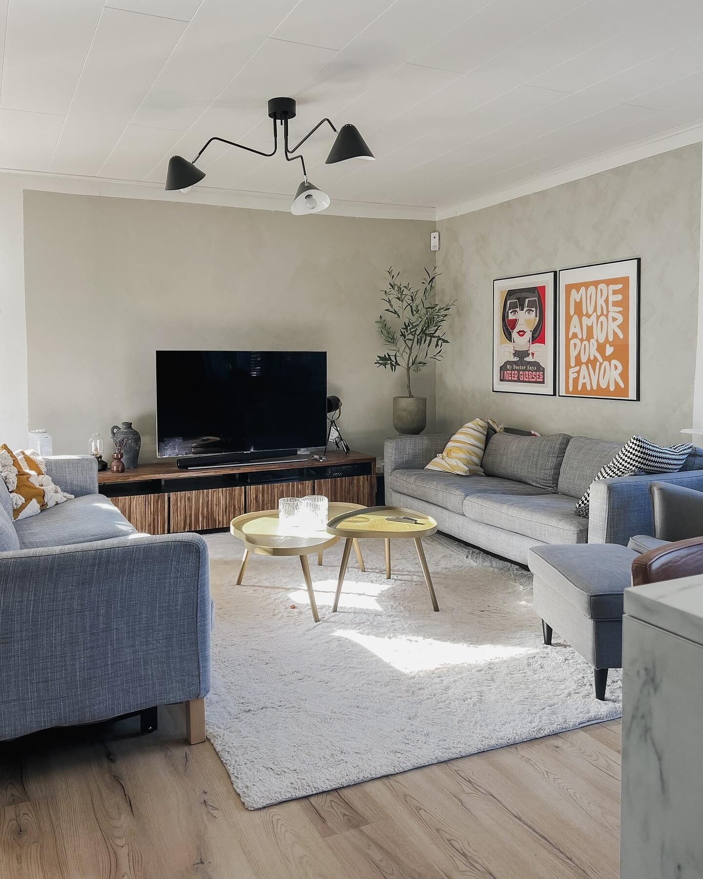 Two graphic art prints add playful personality to a neutral wall
