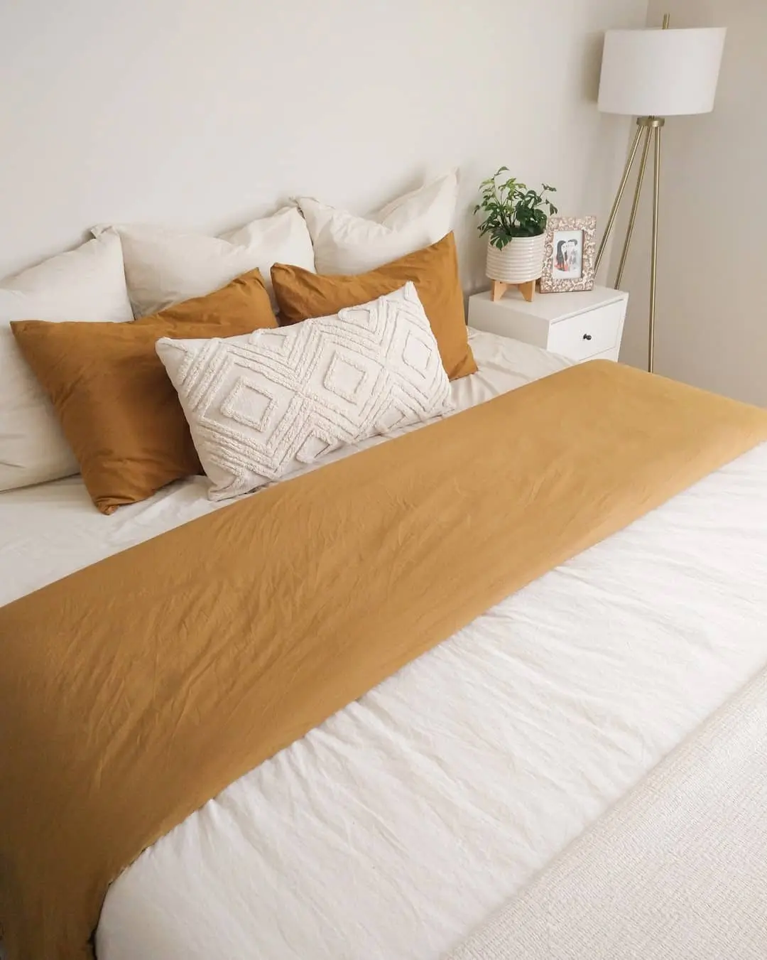 Textured Lumbar Pillow Adds Dimension to Earth-Toned Bedding
