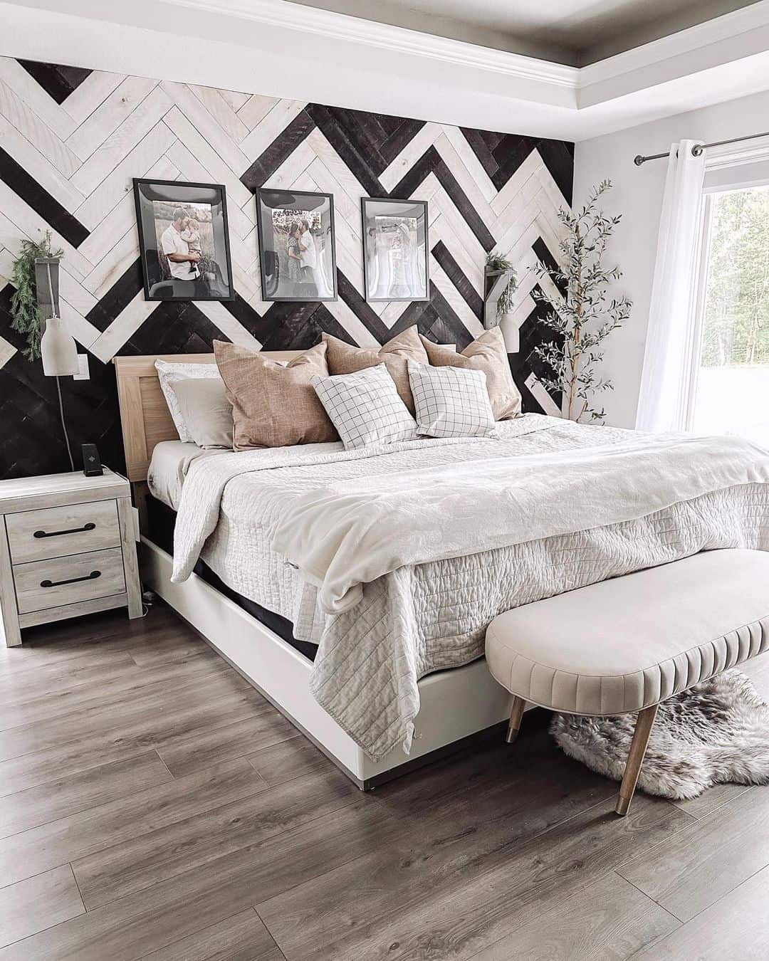 Alternating Black and White Wood Planks Create a Striking Chevron Accent Wall