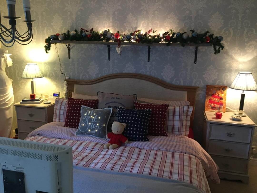 Wooden Shelf With Festive Garland and Lights