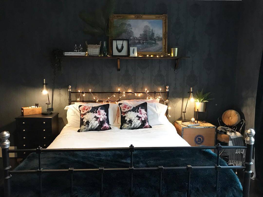 Dark, Patterned Wallpaper Creates a Moody Backdrop