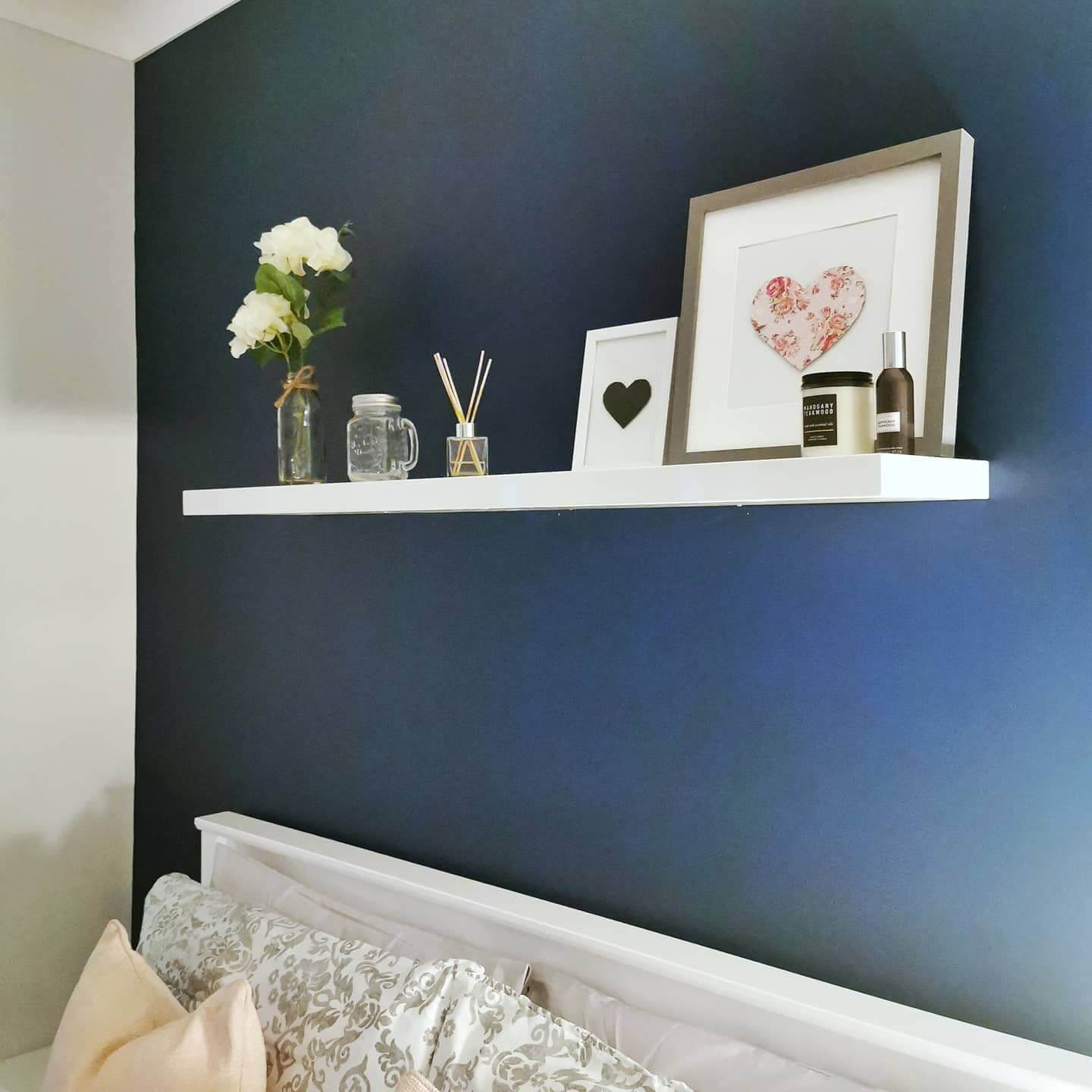 White Floating Shelf With Heart Art and Candle Accents