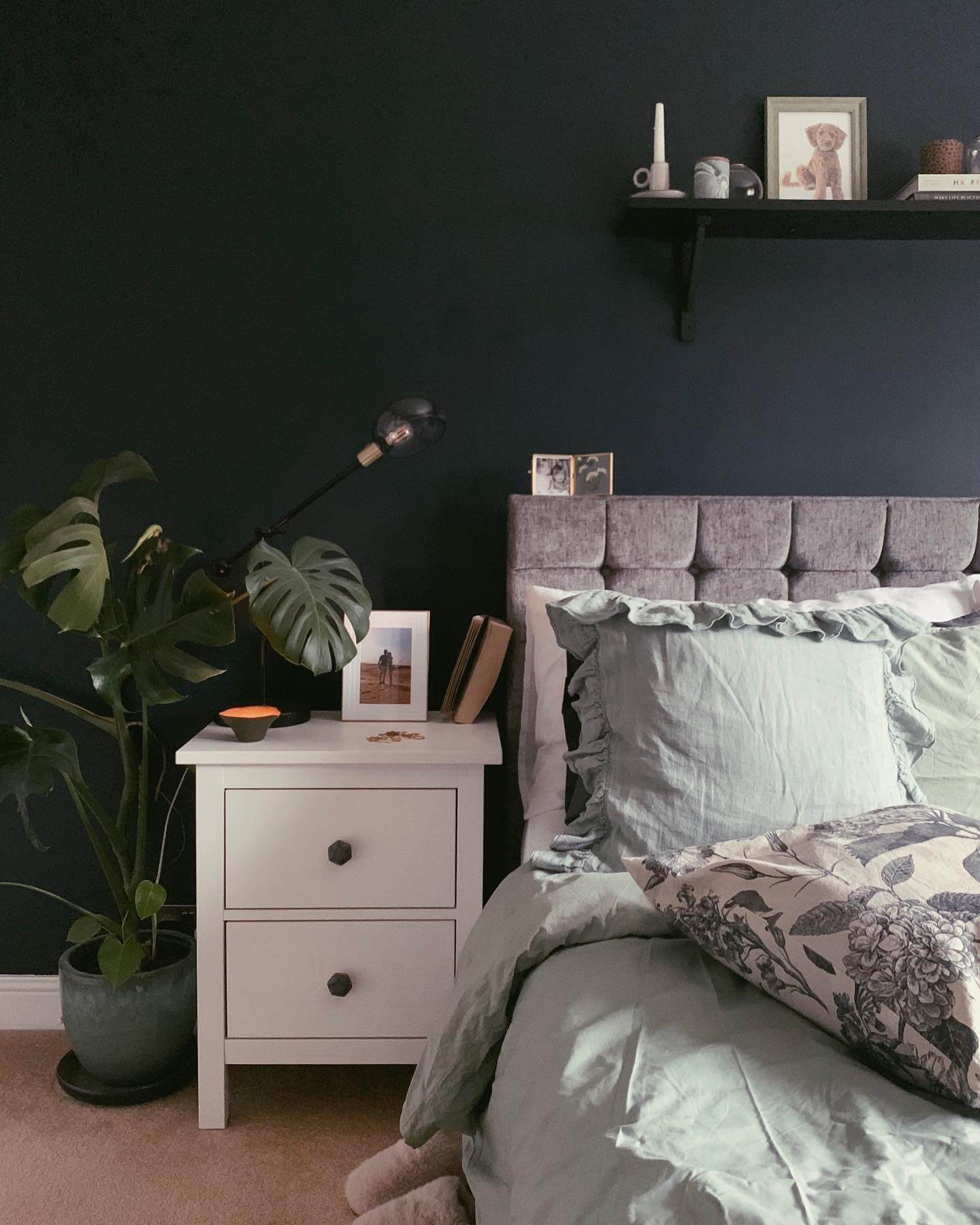 Narrow Black Shelf Displays Artful Groupings and a Candle
