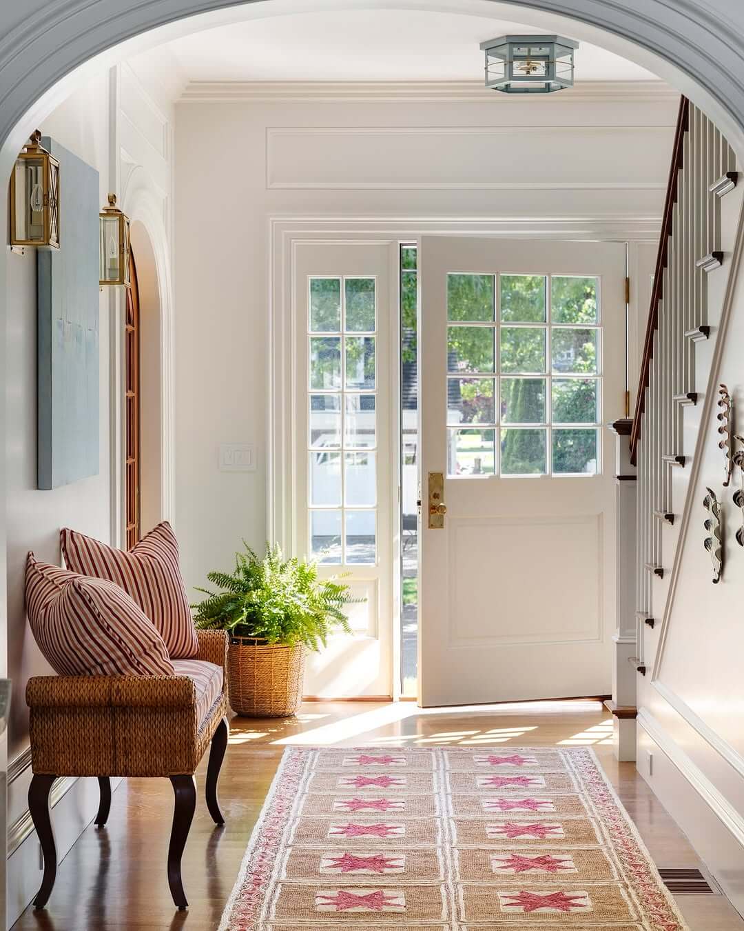 Offer a Cozy Perch with a Woven Bench and Striped Pillows