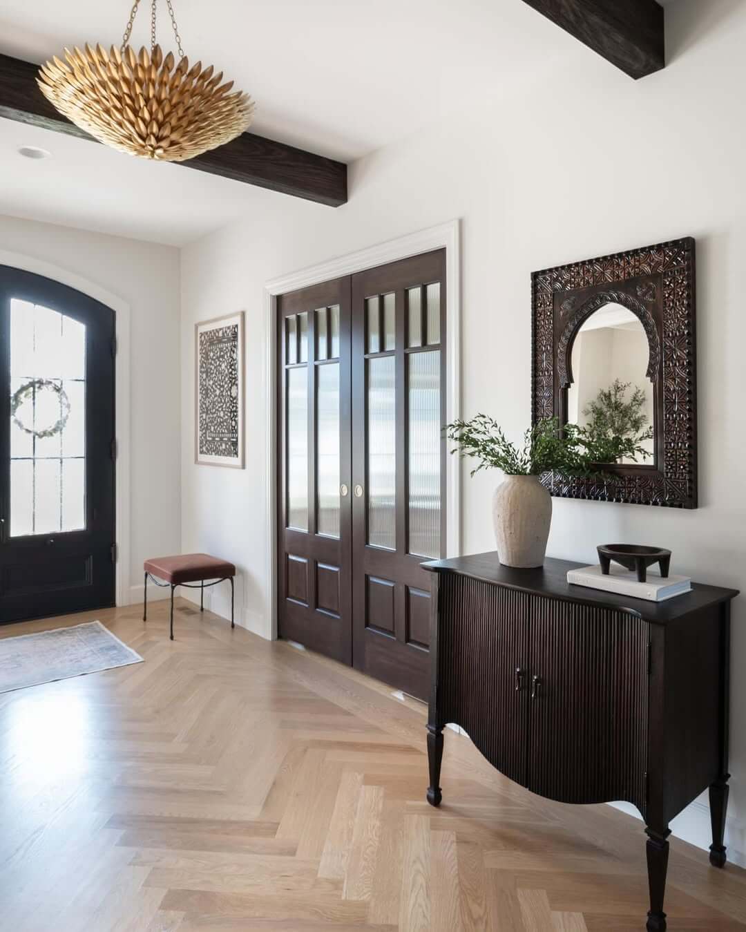 Frame Entryway Views with an Ornate Arched Mirror