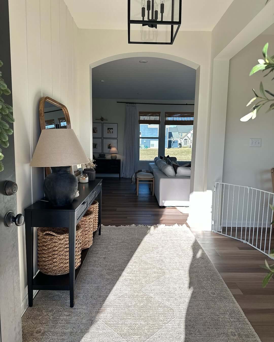 Combine a Tall Black Console Table with Woven Baskets