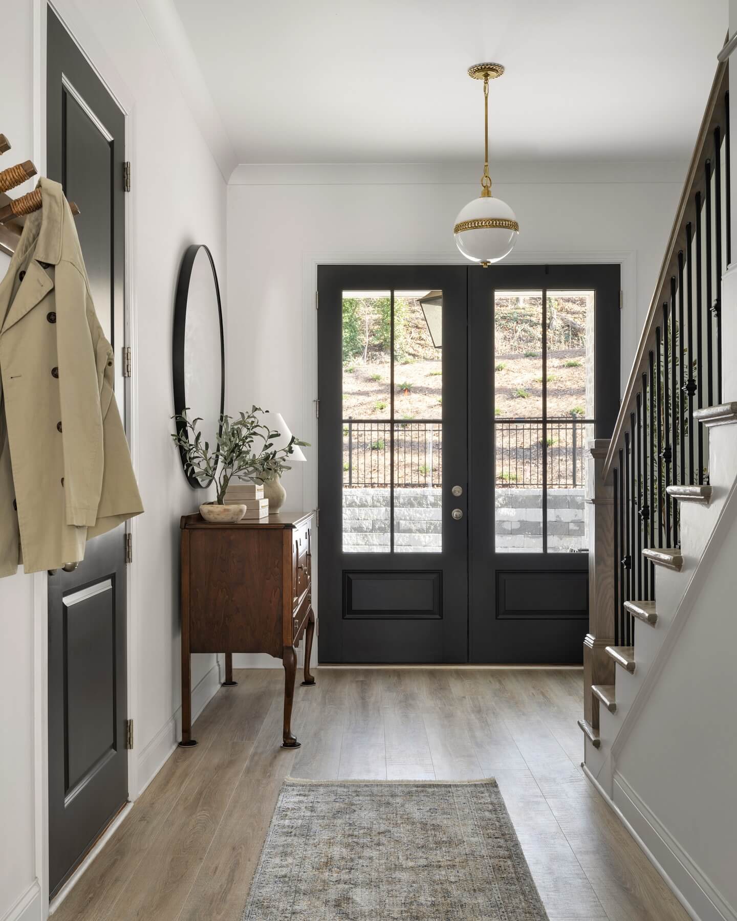 Tall Oval Mirror Adds an Elegant Touch Above a Narrow Dresser