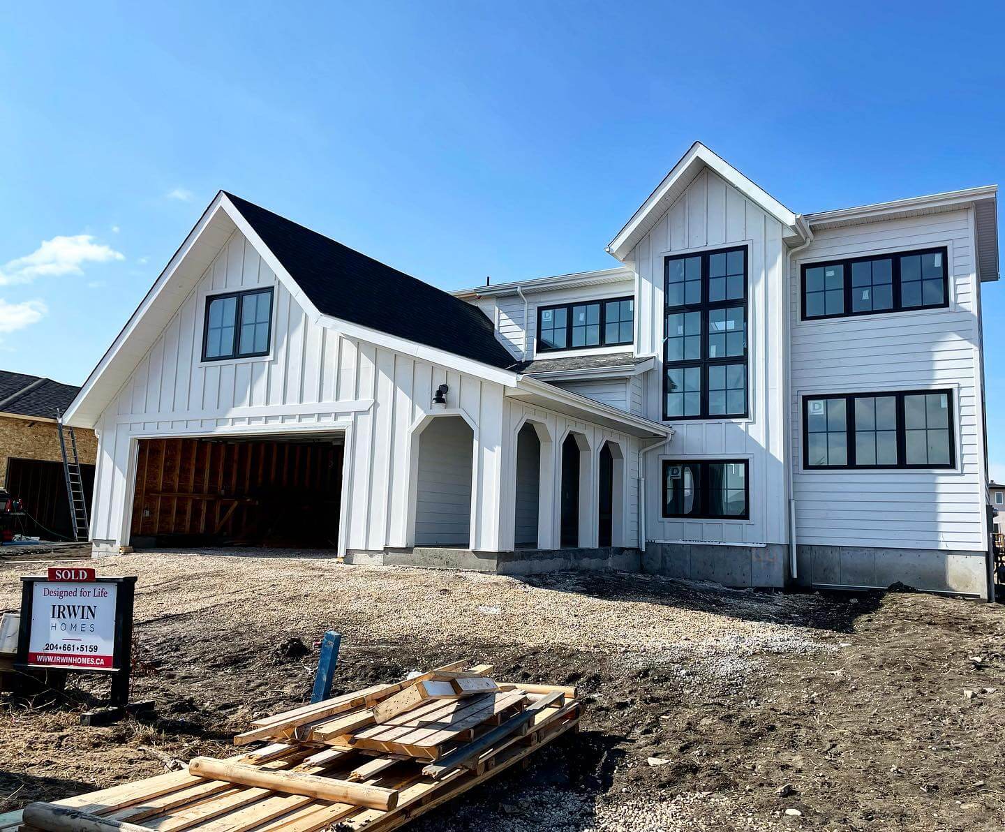 Arched Portico Adds Architectural Interest to White Exterior