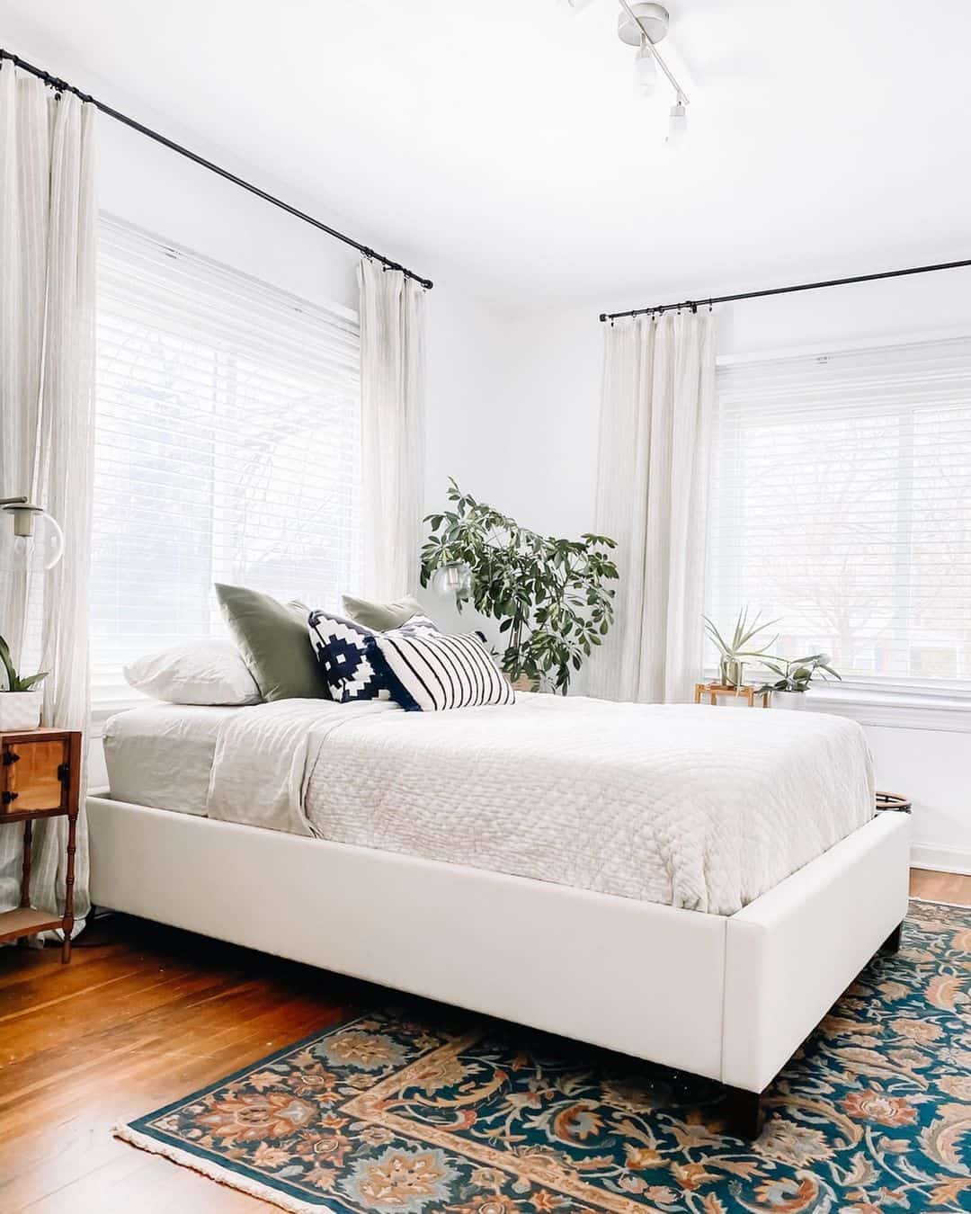 Patterned Pillows Add Graphic Interest to a Neutral Bed