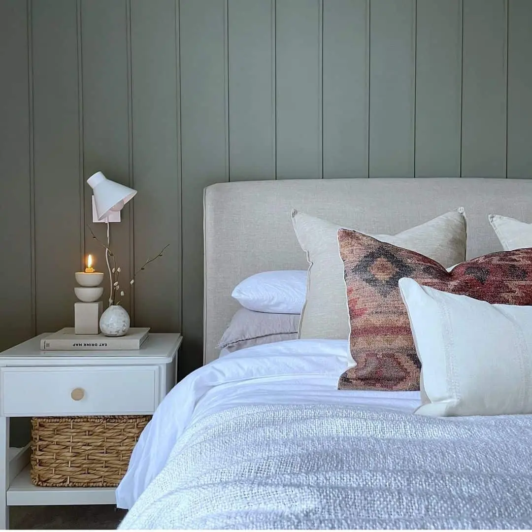 Wall-Mounted Lamp Creates Cozy Bedside Ambiance