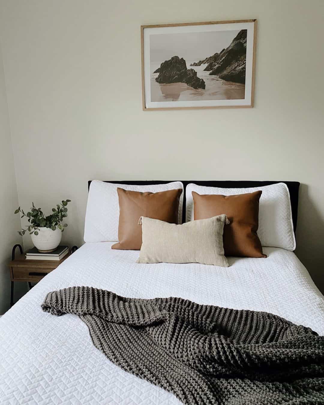 Framed Coastal Artwork Sets a Relaxing Tone Above the Bed