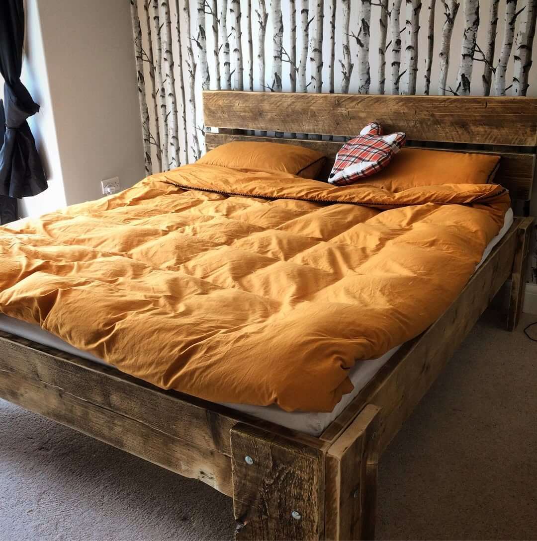 Anchor Your Bed with a Reclaimed Wood Frame Featuring Industrial Bolts