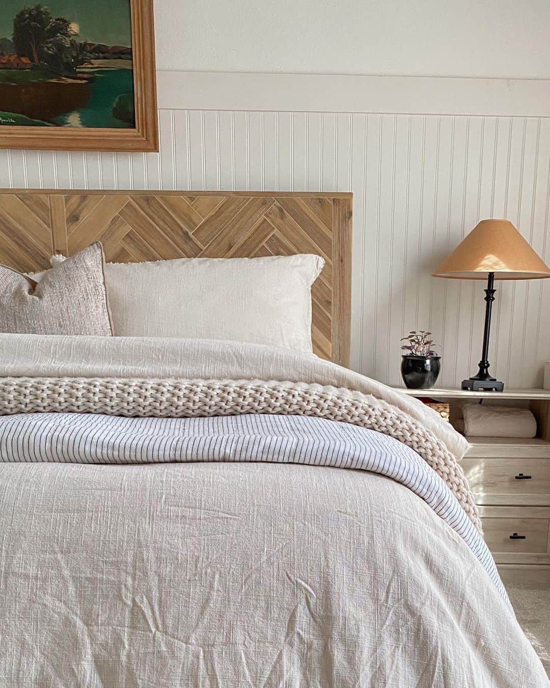 Herringbone Wood Headboard Adds Rustic Pattern Above the Bed