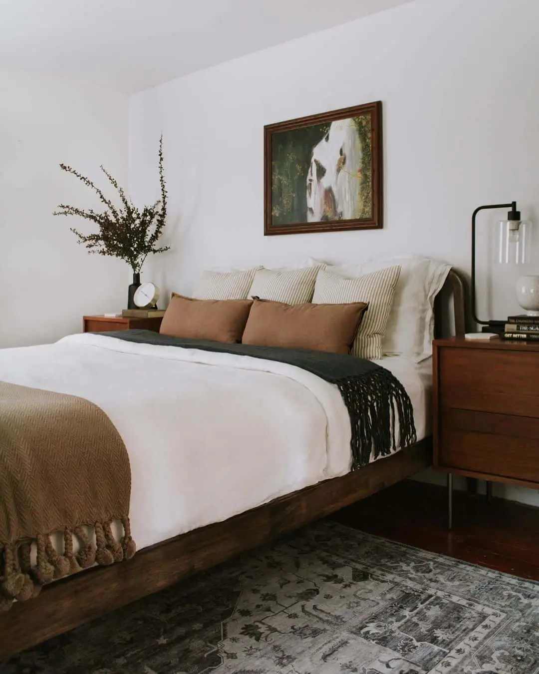 Framed Abstract Art Adds a Moody Focal Point Above the Bed