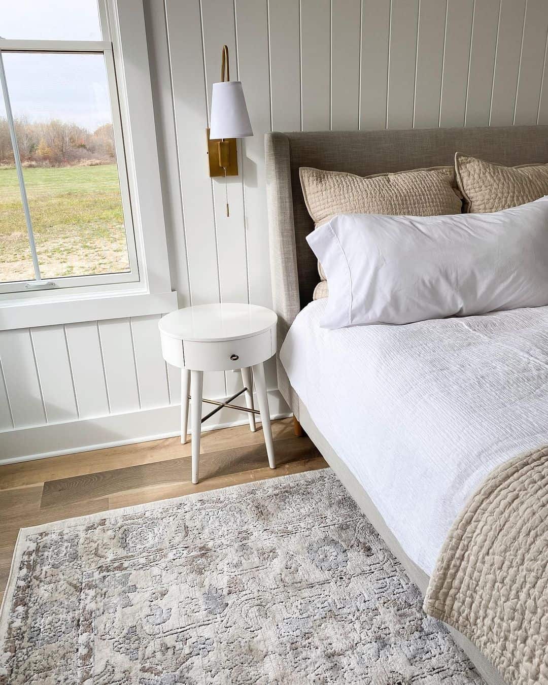 Round White Nightstand With X-Leg Detail