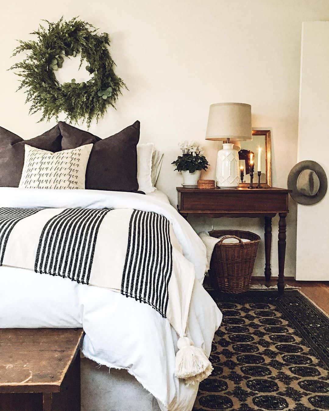 Layered Greenery Adds Natural Texture Above the Bed