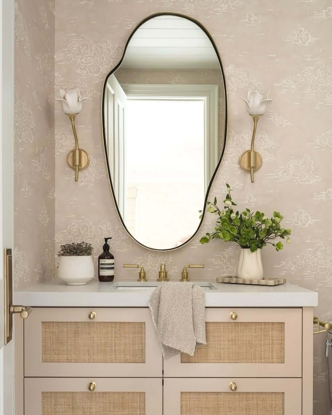 Tulip-Shaped Sconces Mimic Organic Forms on Cloud Wallpaper
