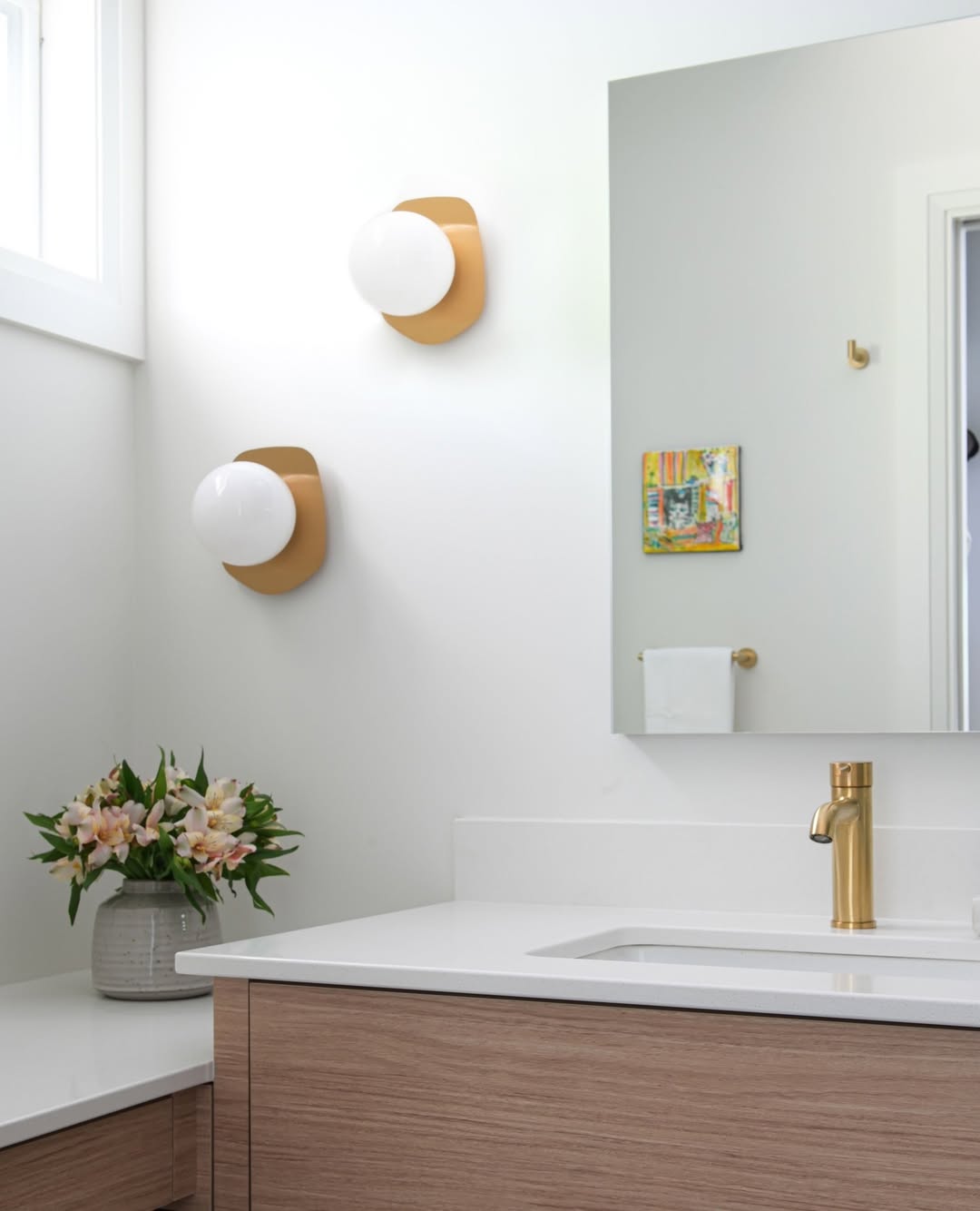 Orb Sconces With Curved Wood-Tone Backplates
