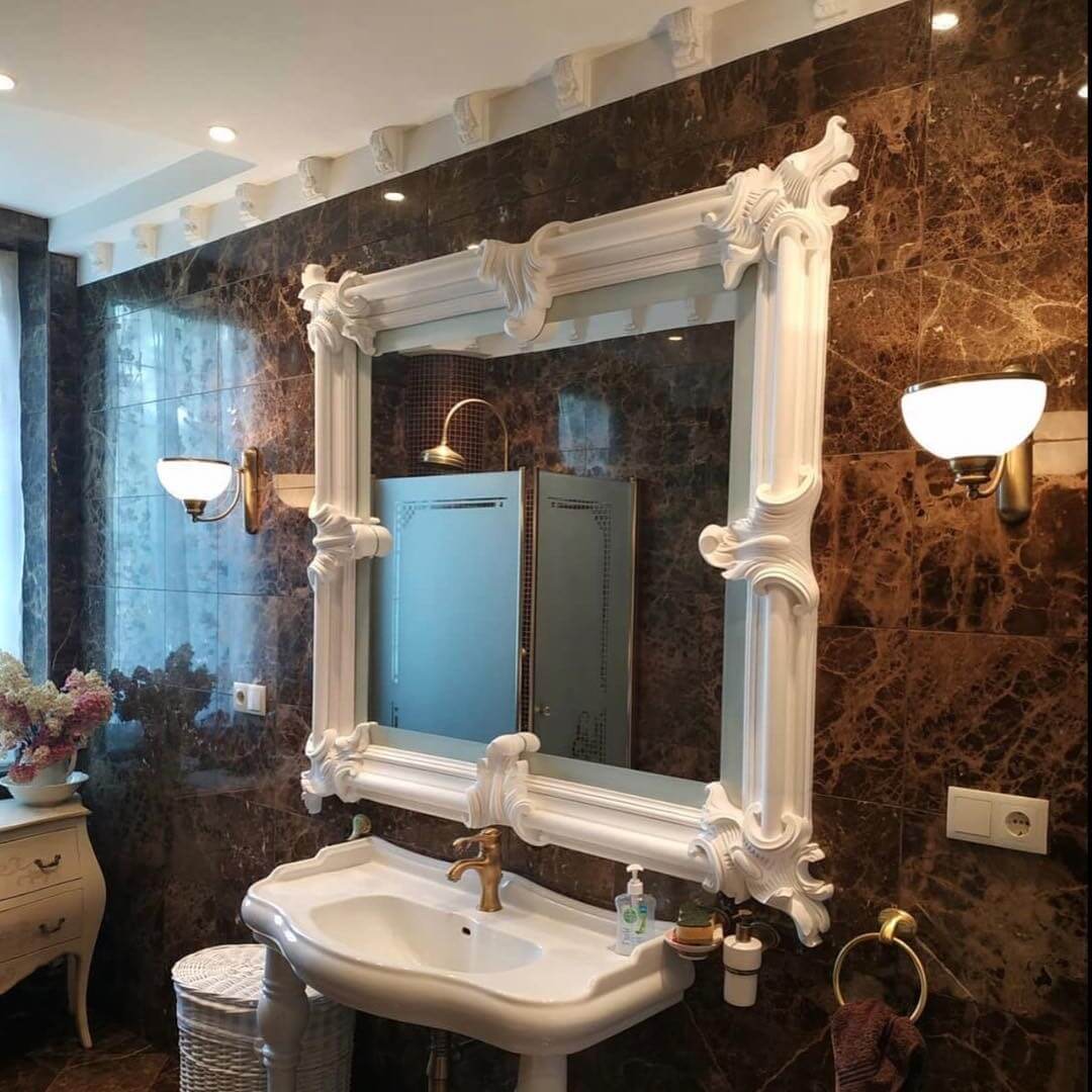 Ornate White Mirror Frame Adds Dramatic Flair