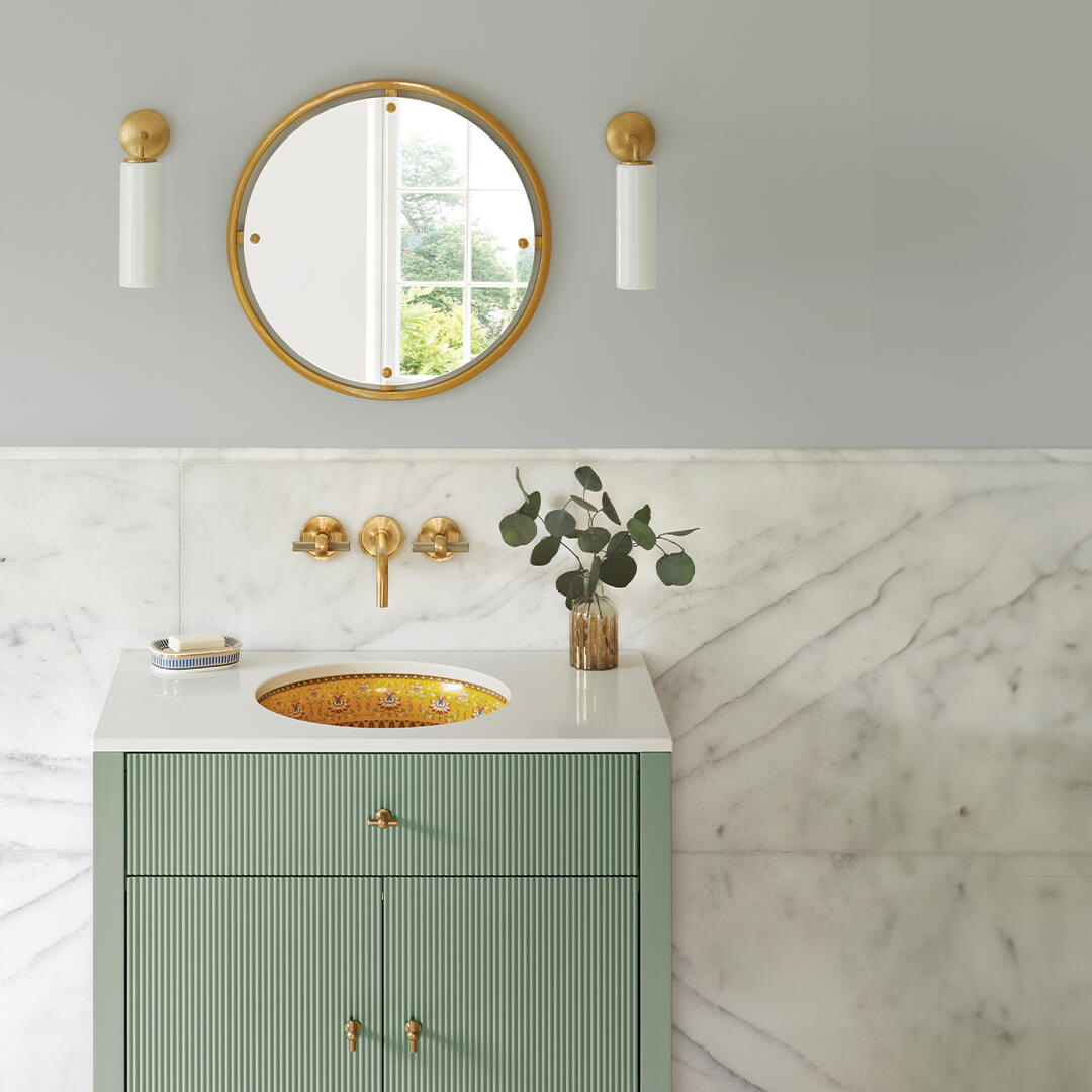 White Cylinder Sconces Flank Gold Mirror