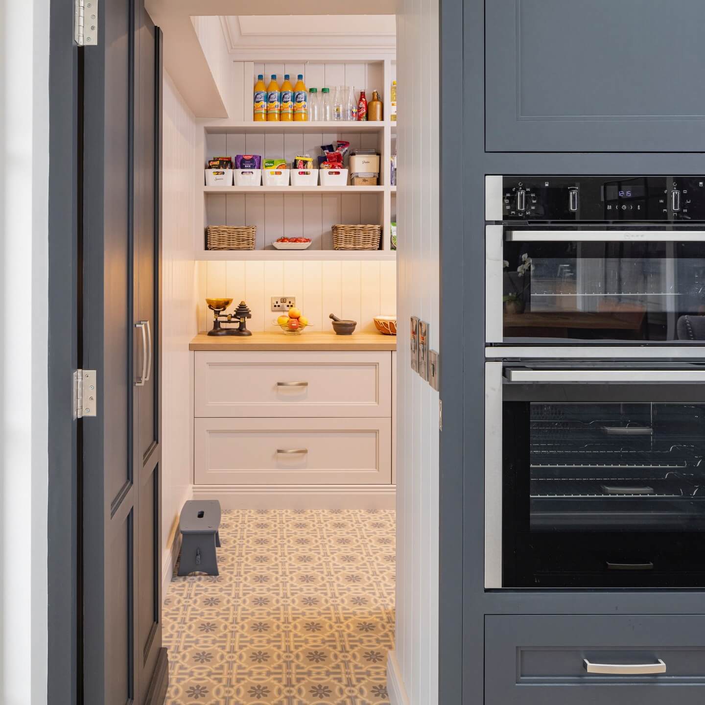 Pantry floor pattern adds a playful touch to practical storage
