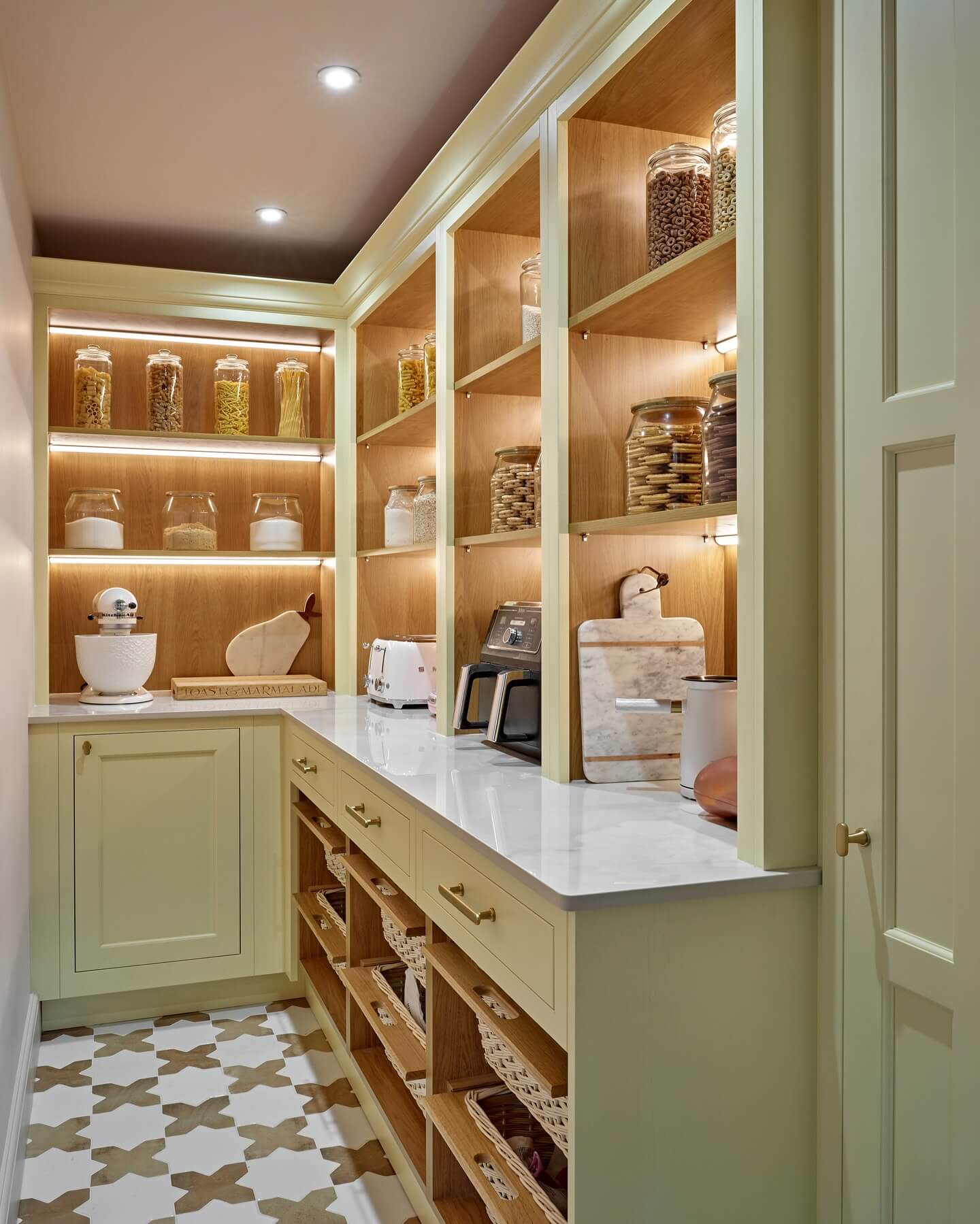Built-in shelving with integrated lighting creates a warm display