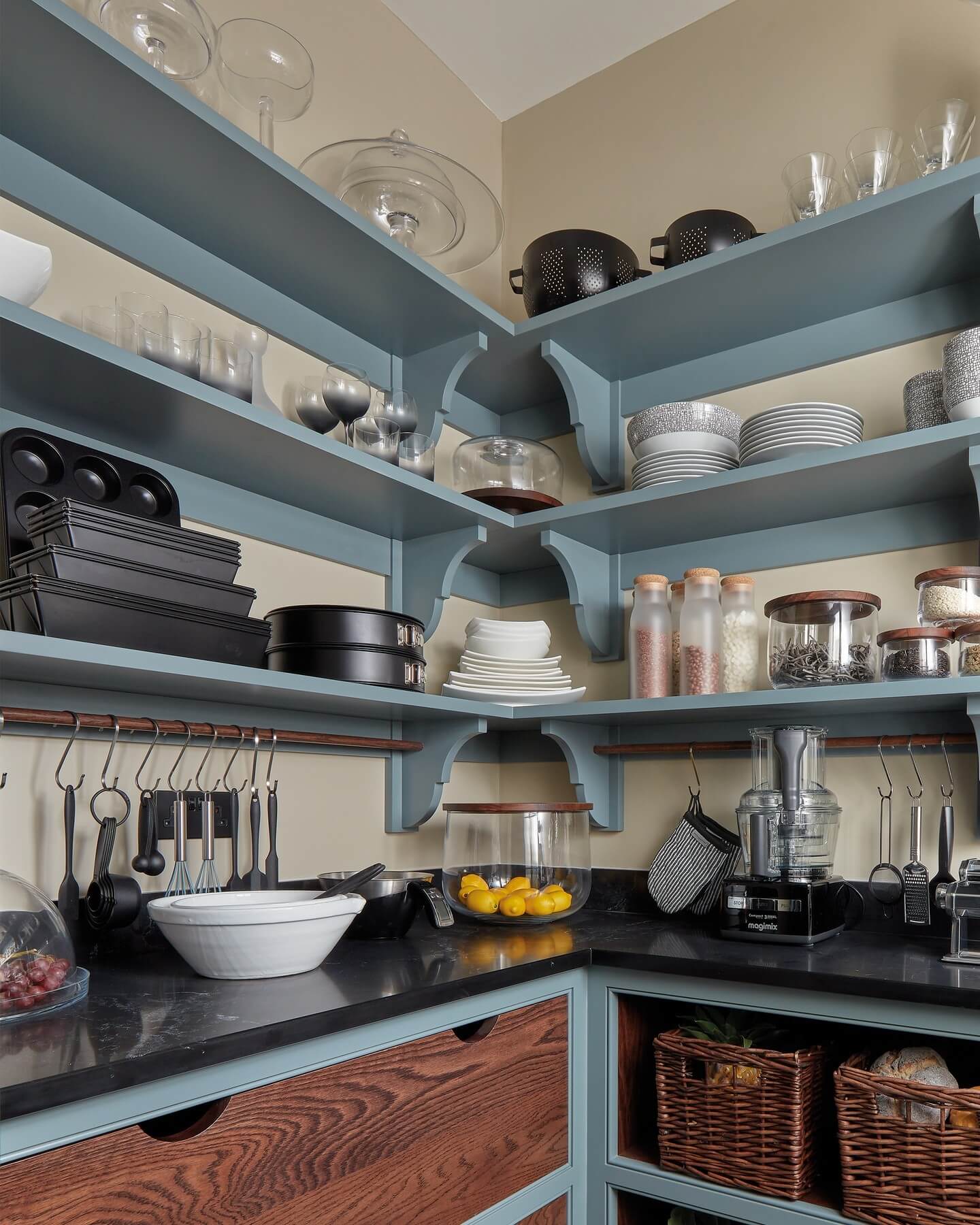 Wooden rod with hanging hooks keeps kitchen tools accessible