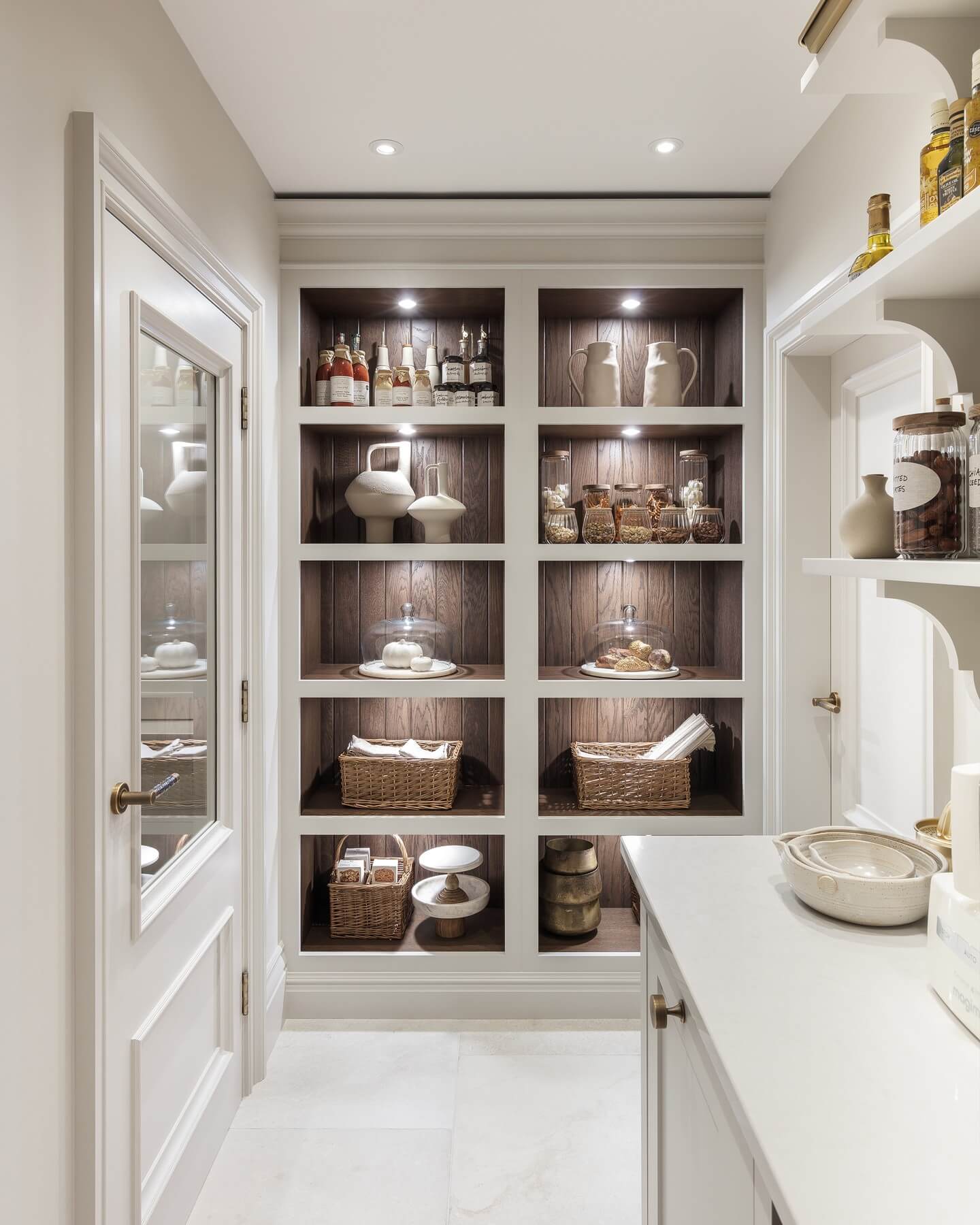 Displaying decorative jars and vases on wood-paneled shelves