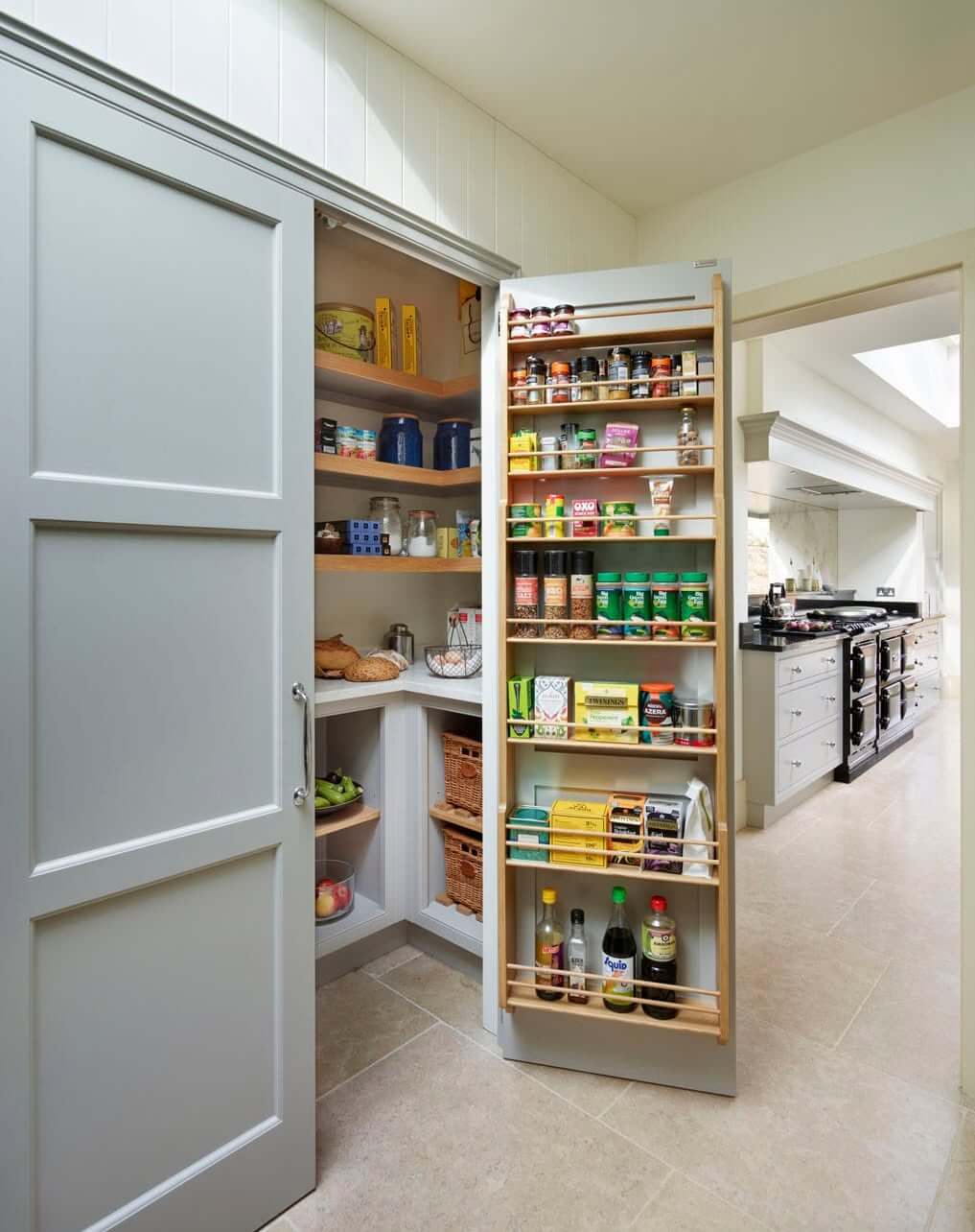 Pull-out pantry shelves with built-in bottle racks keep drinks secure