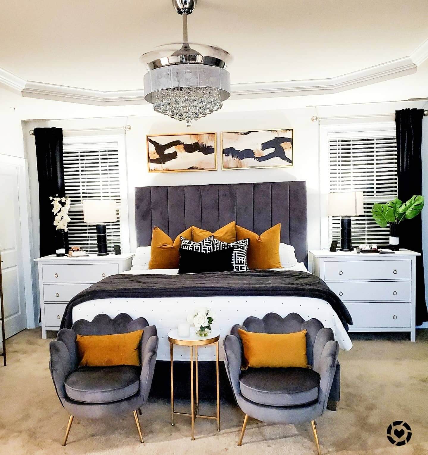 Scalloped Accent Chairs Add Soft Curves to a Moody Bedroom