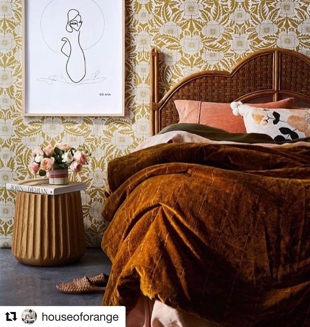 Woven Rattan Headboard Adds Natural Texture to Bold Floral Walls