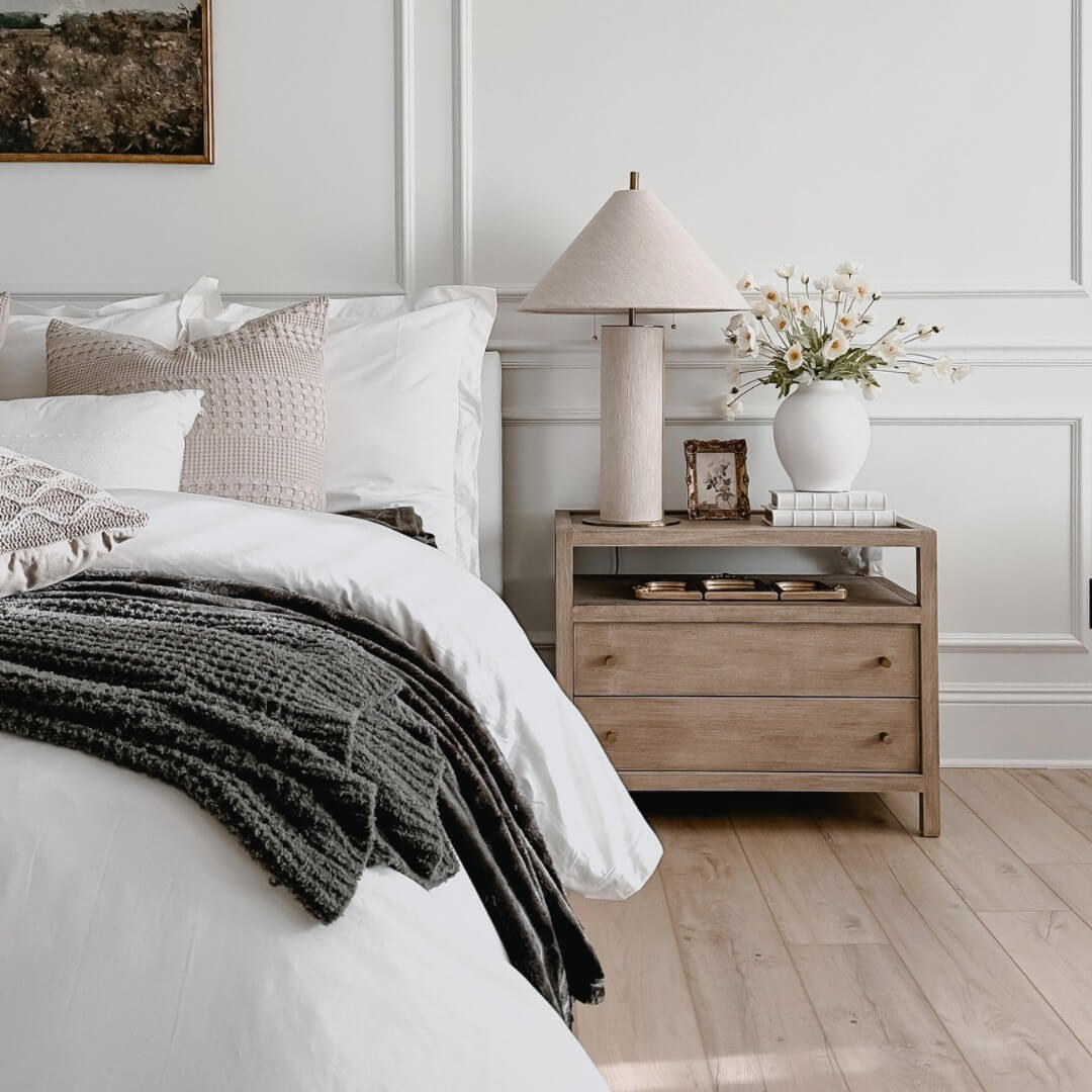 Warm Wood Nightstand with Layered Decor