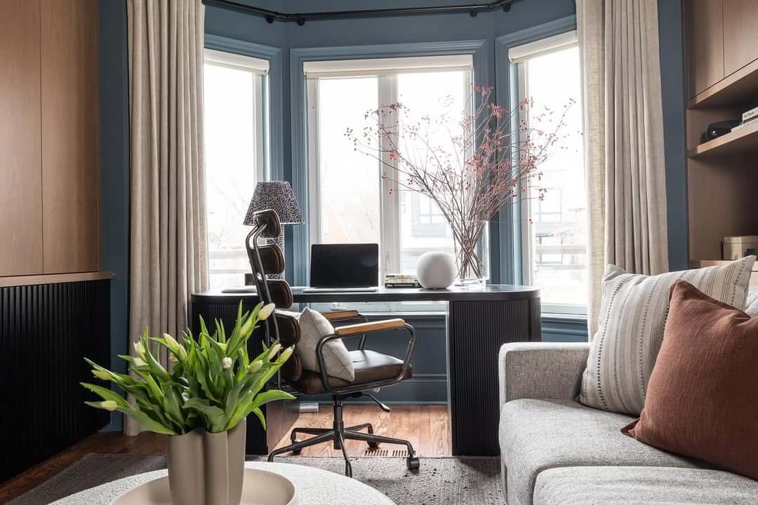Dark Fluted Desk Adds Architectural Interest to Bay Window