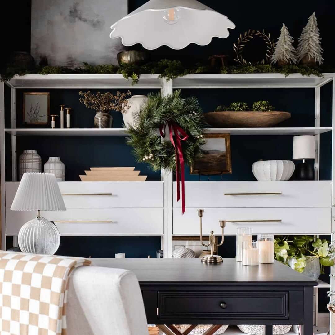 Pine Wreath Adds Seasonal Charm to Dark Shelving