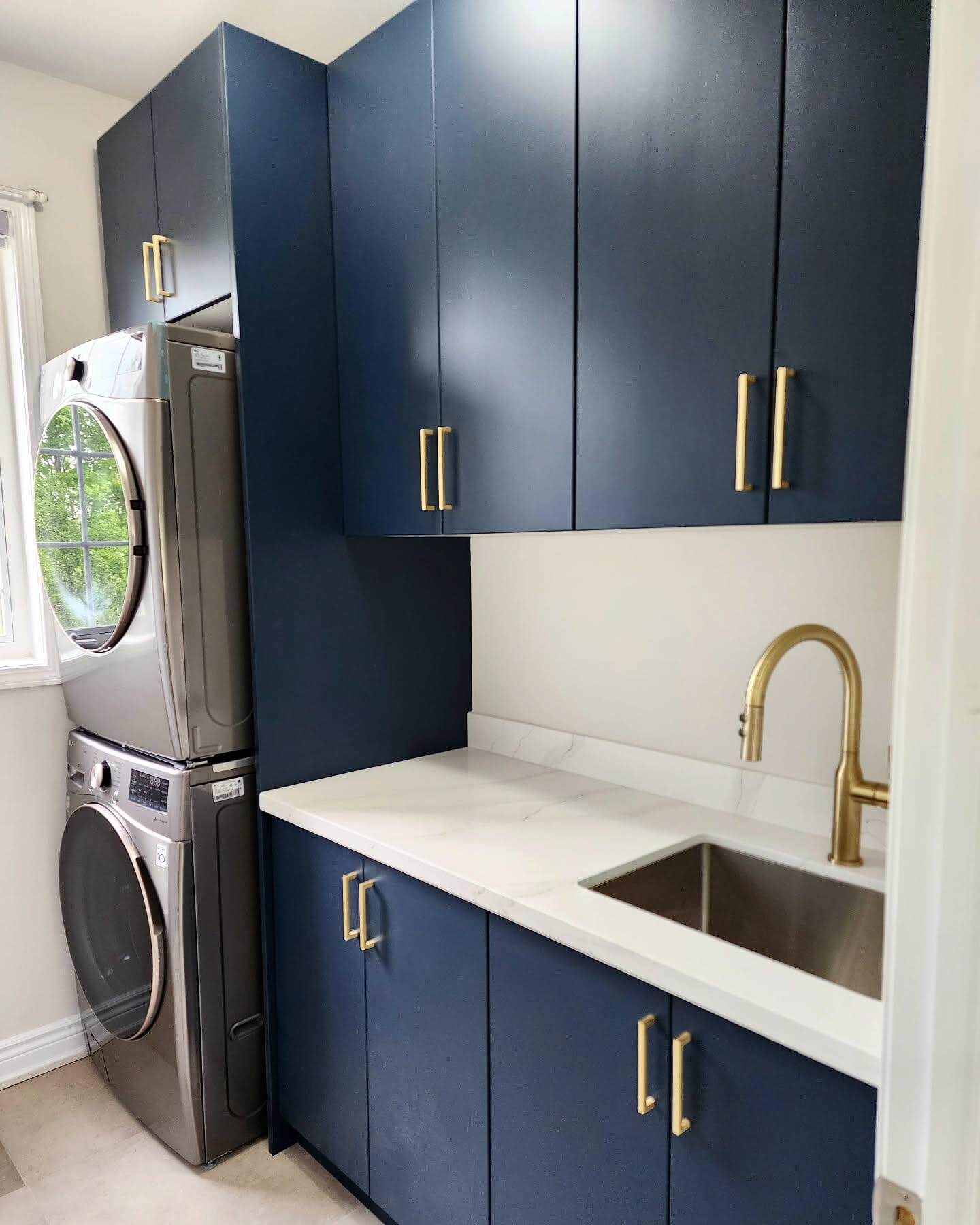 Deep Navy Cabinets with Gold Hardware