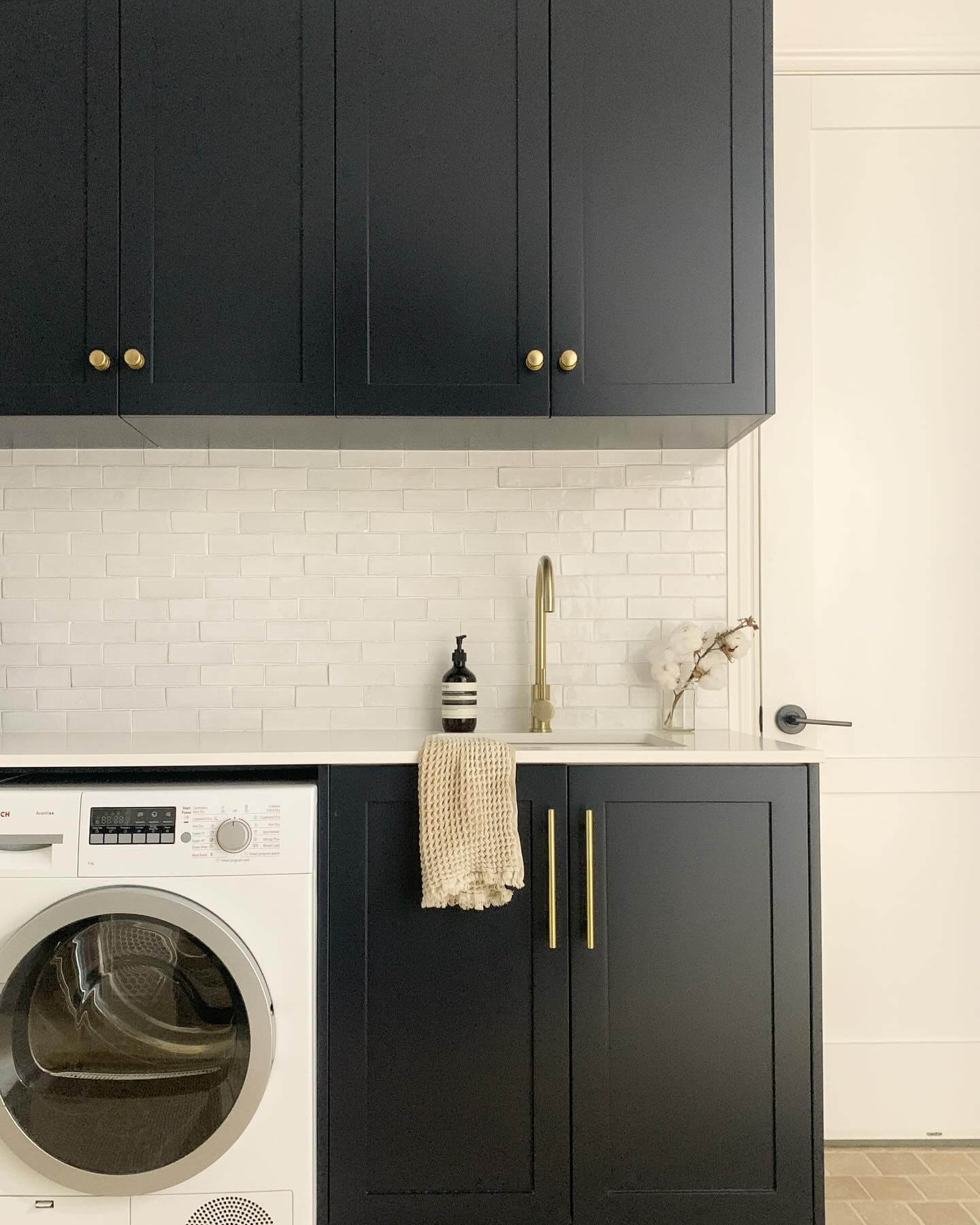 Warm Metal Accents for Dark Cabinetry