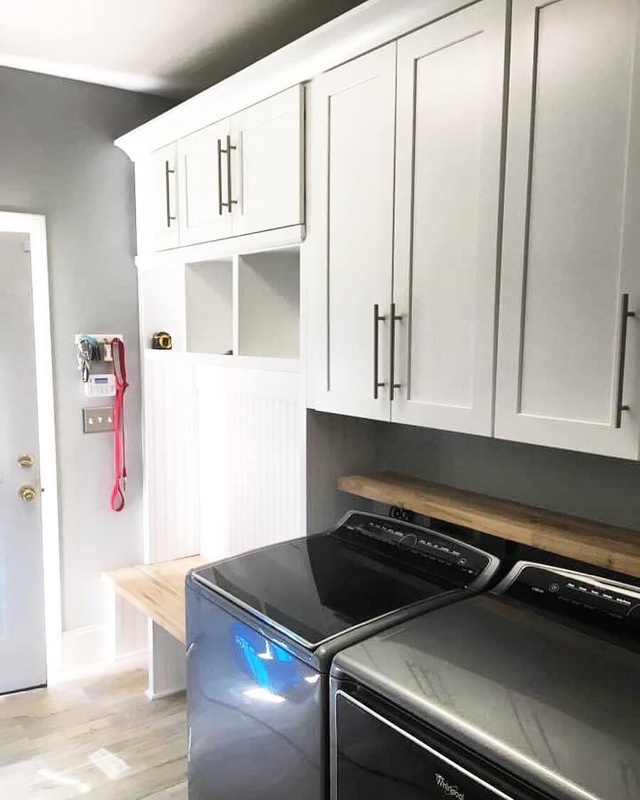 Natural Wood Shelf Above Dark Laundry Machines