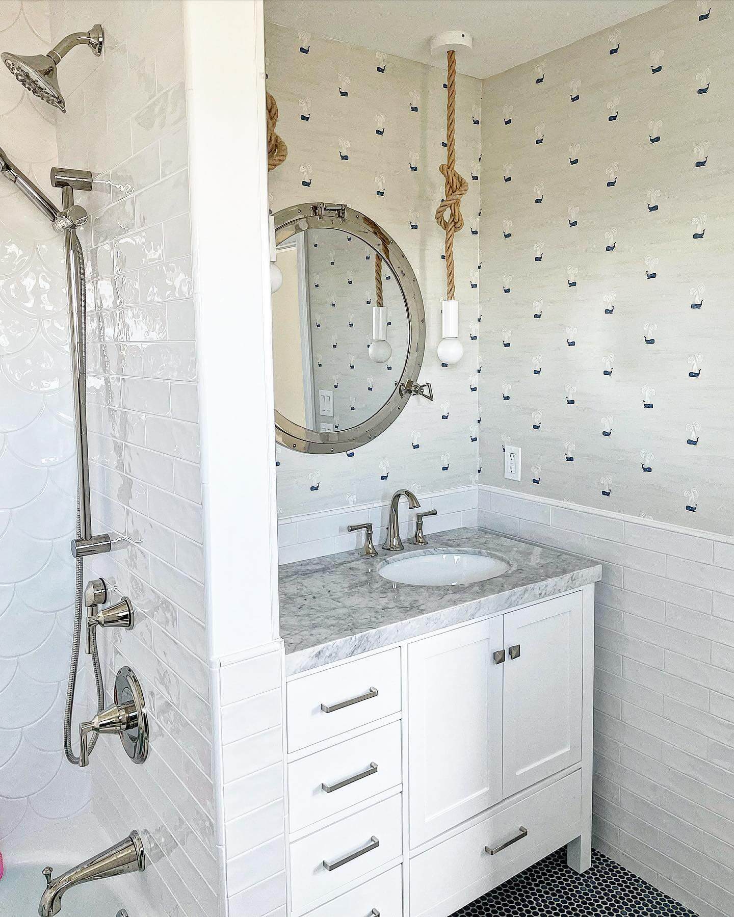Pair Porthole Mirrors with Whale-Patterned Wallpaper