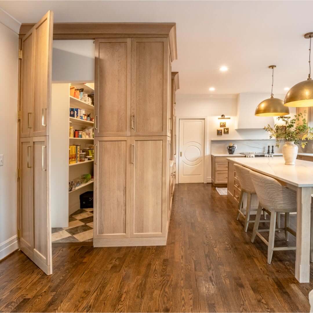 Paneled Doors Slide Open to Reveal a Hidden Pantry