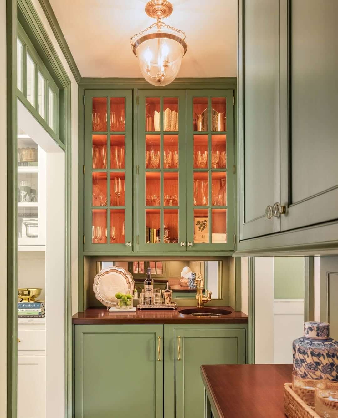 Glass-Fronted Cabinets with Warm Interior Lighting