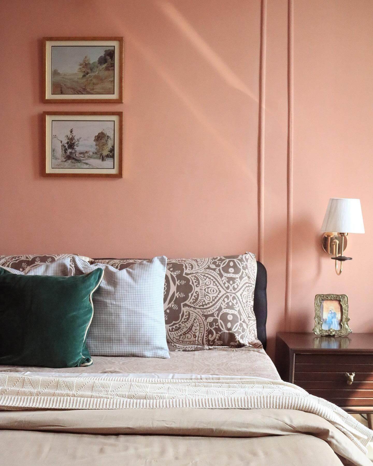 Framed Landscape Art Adds Depth Above Peach Walls