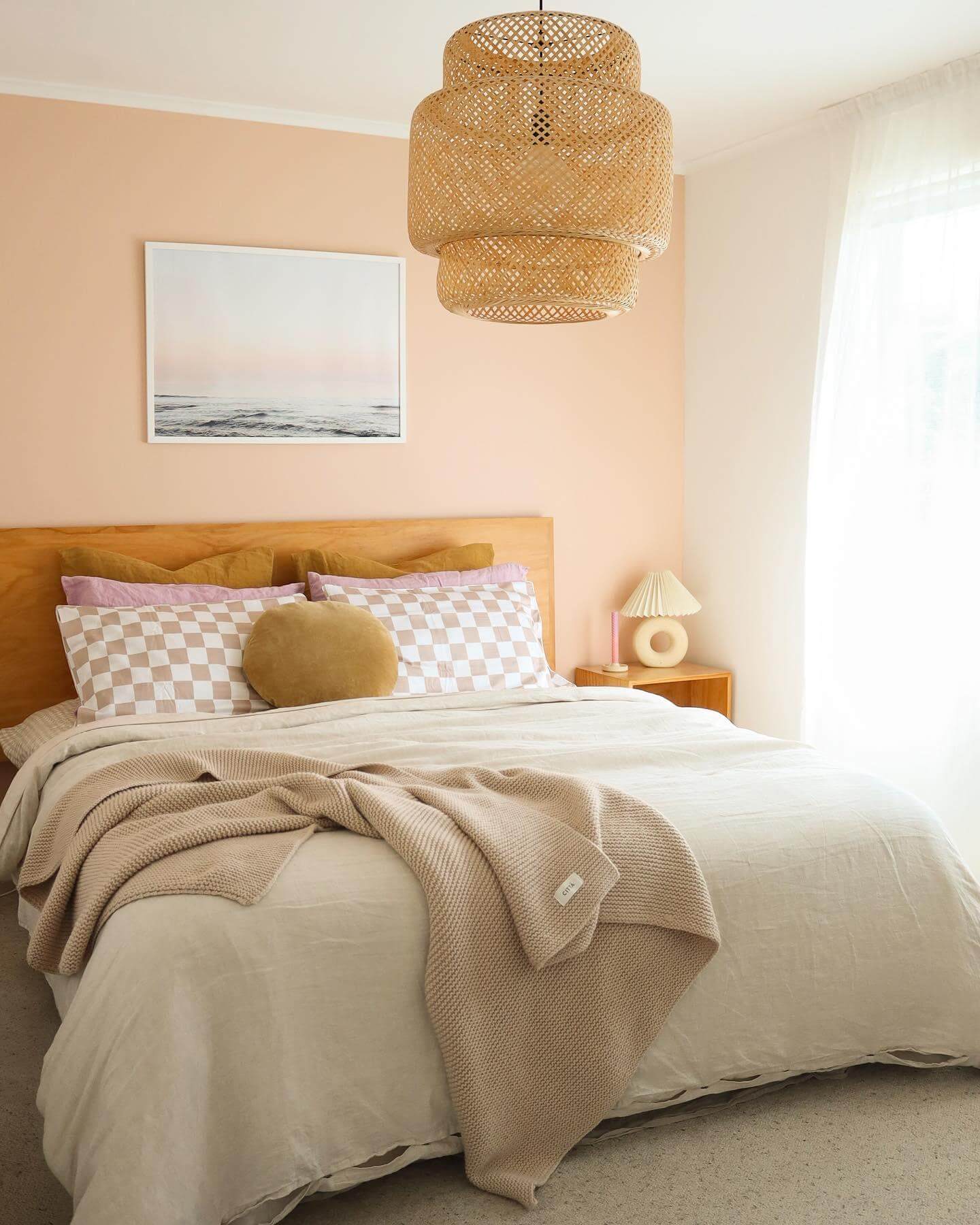 Woven Pendant Light Adds Organic Texture Above Peach Walls